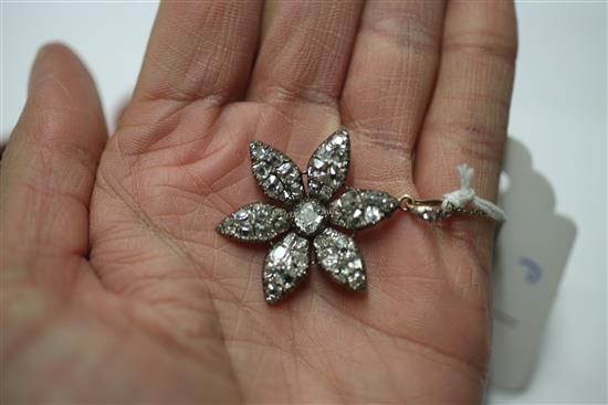 A Victorian gold, silver and diamond encrusted flower head pendant, pendant overall 1.5in.